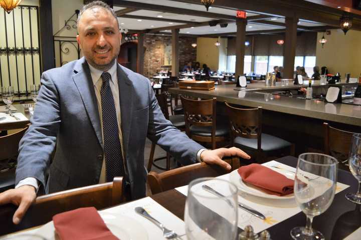 Ulash Geckil, manager, in the new Cinar Turkish Restaurant in Emerson.