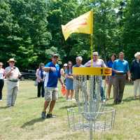 <p>Attendees at Wednesday&#x27;s grand opening take a look at one of the targets players shoot for.</p>