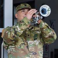 <p>Specialist Andres Marquez of the New Jersey National Guard Honor Guard playing &quot;Taps&quot; at the end of the POW/MIA Recognition Day ceremony.</p>