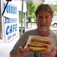 <p>A happy customer with two dogs from Forrest&#x27;s Sidestreet Cafe on the Pawling/Patterson line.</p>