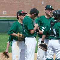 <p>Yorktown pitcher Jim Sharkey (center) talks with his infield during a conference on the mound.</p>