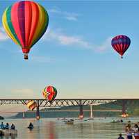 <p>Balloons navigate the Walkway and the Mid-Hudson Bridge during the 2013 festival on the Hudson.</p>