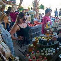 <p>Owner Wayne Outhouse helps a customer on a busy weekend at Outhouse Orchards.</p>