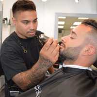 <p>Shave Bar&#x27;s Mike Sebahie trims a clients beard.</p>