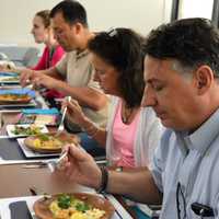 <p>Students in Carrie Weiss's "Zen and the Art of Clean Cooking" classes taste the final results.</p>