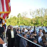 <p>Patrons make their way inside the River Edge Diner with the color guard standing by.</p>