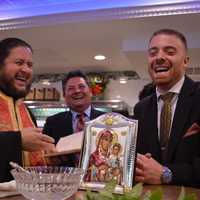 <p>Father Christos L. Pappas of the Ascension Greek Orthodox Church in Fairview blesses the River Edge Diner with owner George Sideras, right, and Mayor Edward Mignone Sunday.</p>