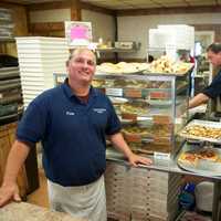 <p>Manager Patsy Femia and Jennie Pagliuca behind the counter at Cacciatori Pizza.</p>