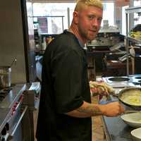 <p>Lake View Bistro Chef Anthony Chach busy at work in the &#x27;open kitchen&#x27; at the restaurant.</p>