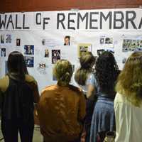 <p>A steady stream of people at the Wall of Remembrance.</p>