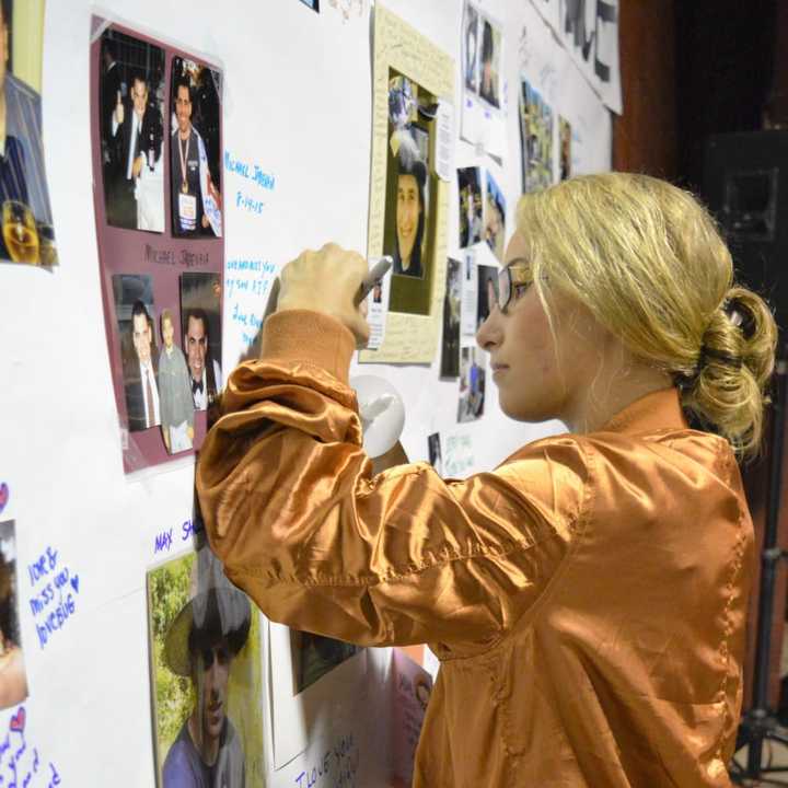 Signing the Wall of Remembrance.