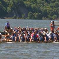 <p>Teams push toward the finish line of the 200-meter course on the Hudson River.</p>