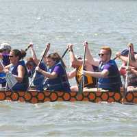 <p>Teams push toward the finish line on the 200-meter course on the Hudson.</p>