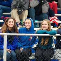 <p>Carmel supporters cheer their team.</p>