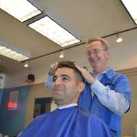 <p>Hillsdale barber Tim Kane works on Jordan Kapp of Paramus, a guidance counselor at Pascack Valley High School. He came to get his haircut on his lunch break and said he liked the old-school barbershop feel.</p>