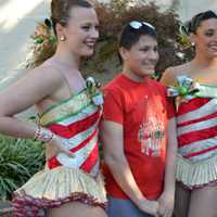 <p>Chris Roberts of Elmwood Park enjoys a moment in the spotlight with two Rockettes at Van Dyk&#x27;s Homemade Ice Cream in Ridgewood.</p>