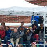 <p>Fans cheer their teams from the stands.</p>