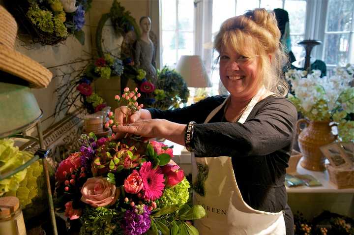 Annabel Green Flowers owner Wendy Manes prepares arrangements for Mother&#x27;s Day in her Wilton shop.