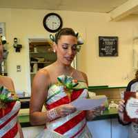 <p>Rockettes Sarah Staker, left, and Nicole Baker Luftig present a certificate to the owners of Van Dyk&#x27;s Homemade Ice Cream - Corinna and Demetrios Kotrokois.</p>