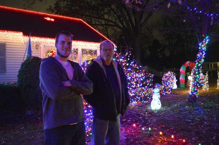 Kevin, left, and Wayne McCarthy of Paramus spend weeks programming their annual Christmas lights display.