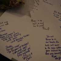 <p>Friends left notes for Brooke on posters outside of the field house at Saddle Brook High School.</p>