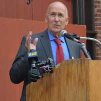 <p>Hackensack John Labrosse addresses a gathering outside the old Masonic Lodge on State Street.</p>