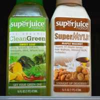 <p>Cold-pressed CleanGreen Sweet Leaf juice and Maple Walnut SuperMylk.</p>