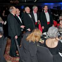 <p>The Traveling Men Quartet sings at different tables throughout the evening.</p>