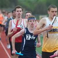 <p>Runners compete in the boys 4x400 Friday at the Joe Wynne Somers Lions Club Track &amp; Field Invitational.</p>