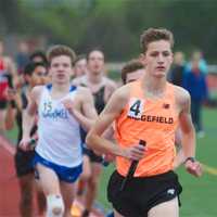 <p>A Ridgefield runner in a boys relay event at Friday&#x27;s meet.</p>