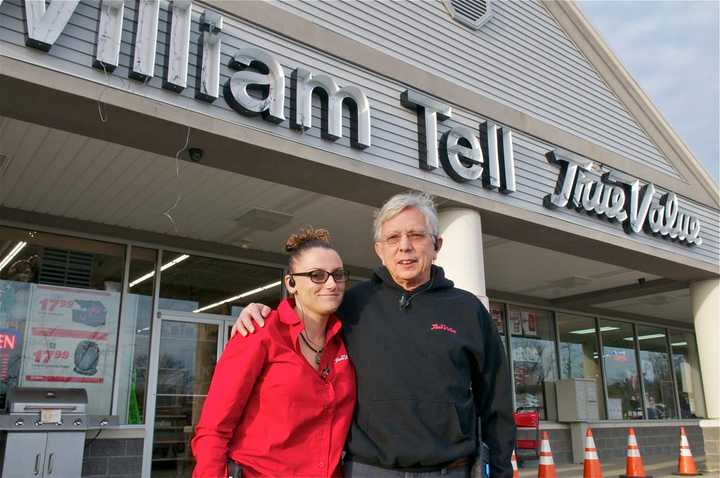 Carrie and David Tell in front of the new William Tell True Value Hardware store in Hopewell Junction.