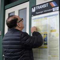 <p>Bob Pilser at the NJ Transit station in Allendale figures out when he can get back home to Ho-Ho-Kus.</p>