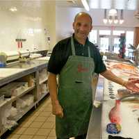 <p>Gus&#x27;s Peter Kissel shows off the fresh seafood selection at Gus&#x27;s.</p>