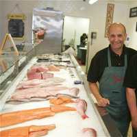 <p>Butcher shop manager and Master Butcher Peter Kissel (L) and store manager Jamie Martinez show off the store&#x27;s fresh seafood.</p>