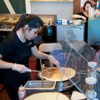 <p>A family waits for crepes at Sunday&#x27;s Chocolate Expo.</p>