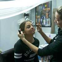 <p>Laura Rudovic does makeup for a client at her Carmel boutique.</p>