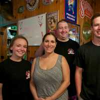 <p>Owner Chris Casino (back) with some of the staff at his Mahopac location.</p>