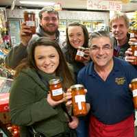 <p>Vinny Lamorte (center) and happy customers with his new Fra Diavolo Marinara Sauce.</p>