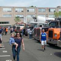 <p>The parking lots is filled with emergency vehicles, motorcycles and the big rigs at Saturday&#x27;s Barnum Festival Touch-A-Truck event at Fairfield Ludlowe High School.</p>