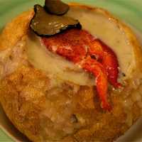 <p>The Seafood Chowder soup at Silver Spoon is packed with clams, mussels, shrimp, calamari and lobster, and served in a crispy bread bowl.</p>