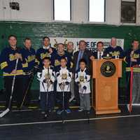 <p>Yonkers Mayor Mike Spano with the gear donated by the NHL Players&#x27; Association to help outfit the Yonkers Force hockey team.</p>