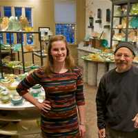 <p>Kaelyn Haggerty and owner Michael Benzer at Hudson Beach Glass.</p>