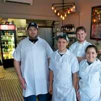 <p>Chef/owner Brian Arnoff with some of the staff from Kitchen Sink Food &amp; Drink.</p>