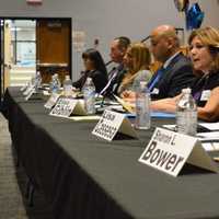 <p>School board candidates answering questions.</p>