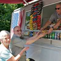 <p>Sal and Tina Celona have worked the truck for 25 years, and their specialty is hot dogs, and their own home style chili and onions.</p>