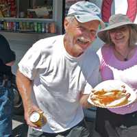 <p>Happy regulars with hot dogs from Charchael&#x27;s.</p>