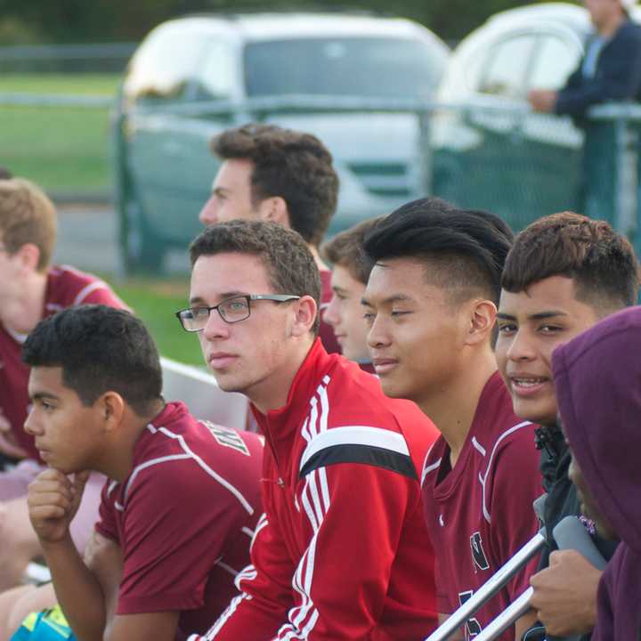 The Nyack bench watches the action.