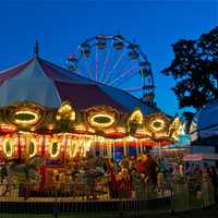 <p>The merry go round at opening day at the fair.</p>