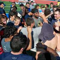 <p>Lourdes players huddle up at the end of a practice.</p>