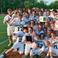 <p>The Pleasantville High boys lacrosse team holds the championship plaque.</p>